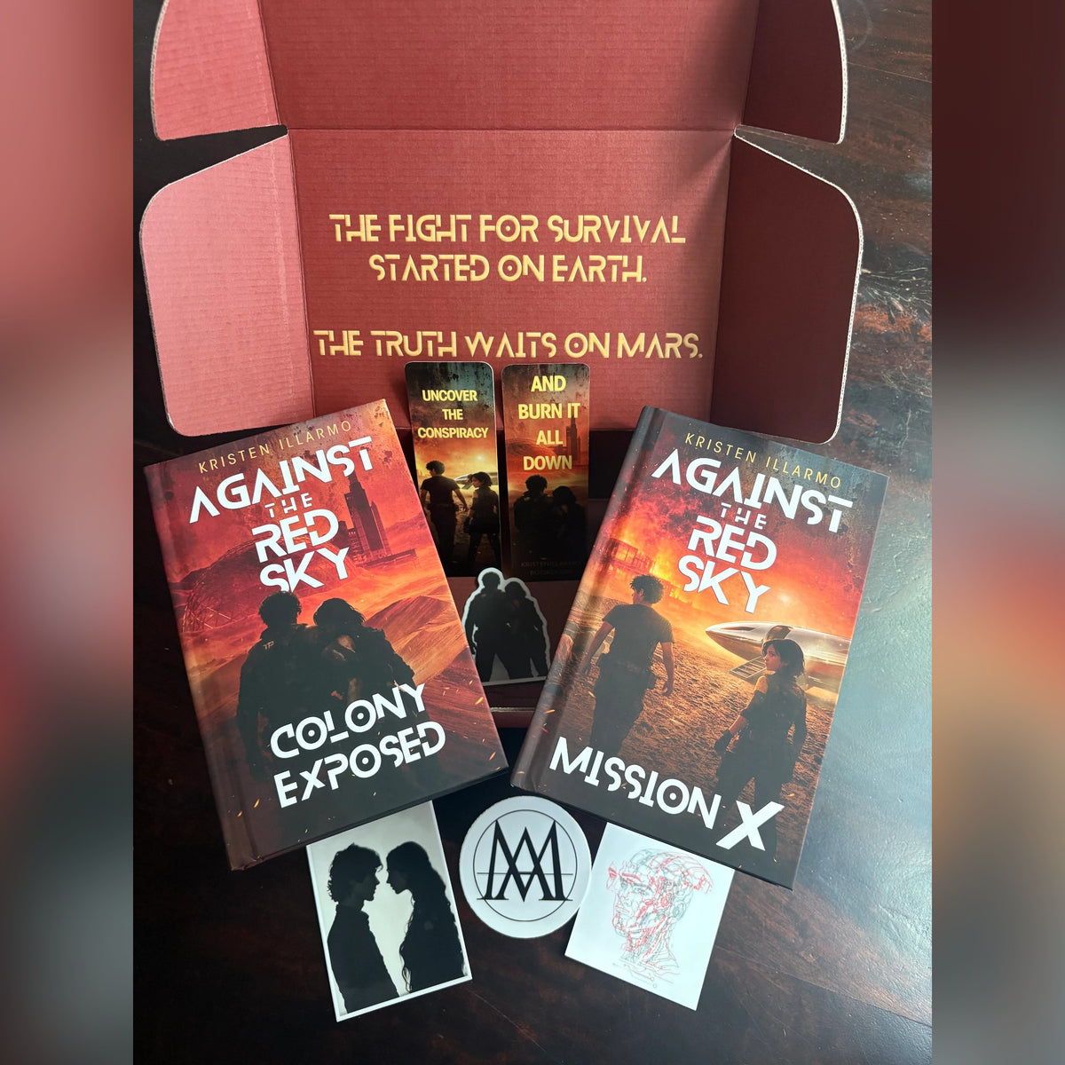 Against the Red Sky Book Box contents: both signed hardcovers, stickers and a bookmark