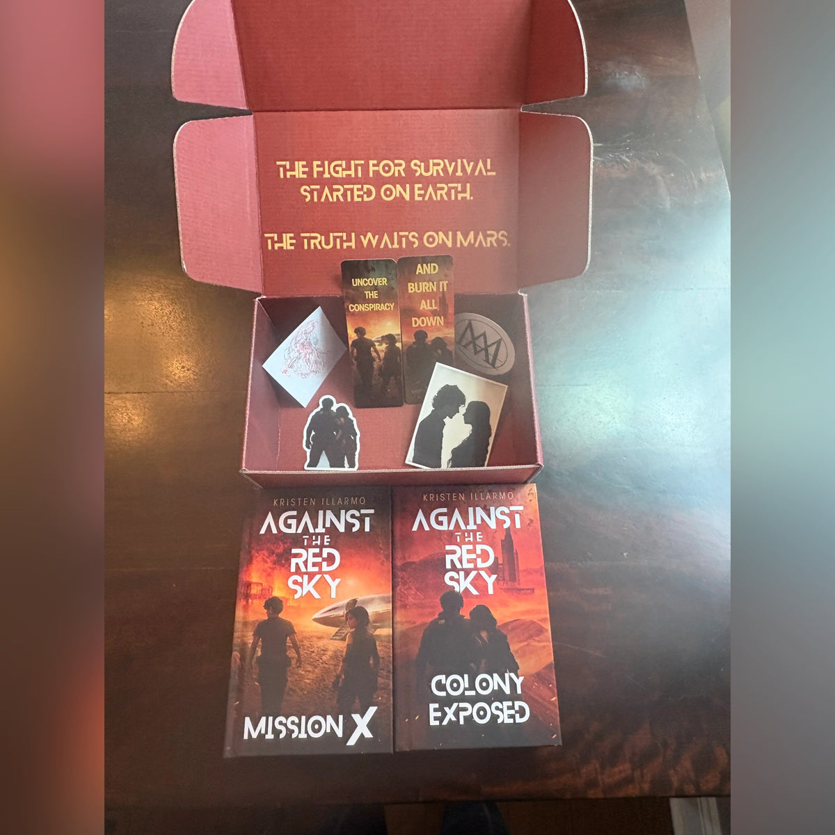 Inside the Against the Red Sky Book Box, with the hardcovers and extras