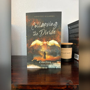 Collapsing the Divide paperback by Kristen Illarmo on a wooden table
